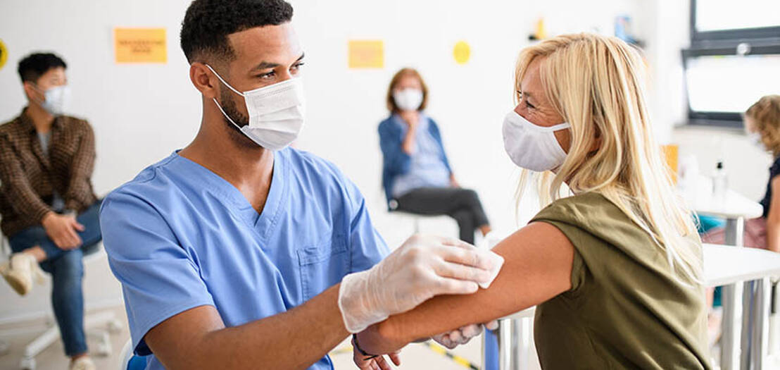 male nurse administering a shot